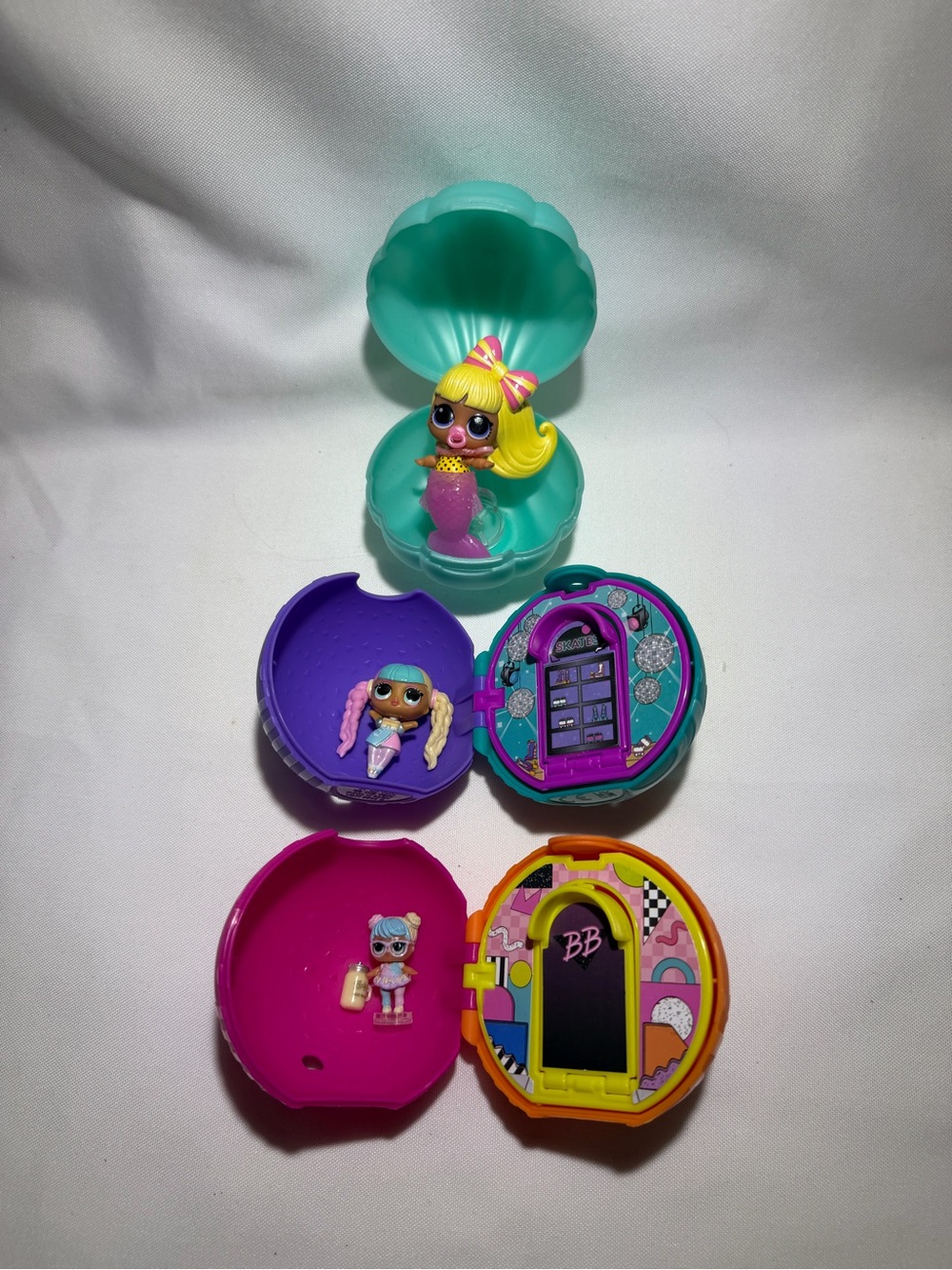 L.O.L. Surprise! Mini Dolls with Teal, Purple, Pink, Yellow & Orange Pods